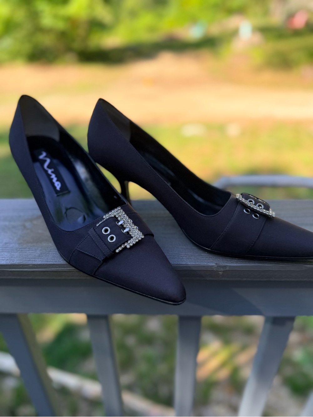 Nina Black Satin Pointed Toe Pumps with Crystal Buckle Accent
